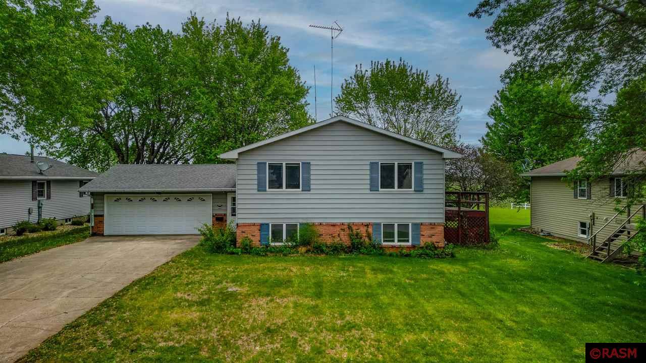Spacious Split-Level Home on a Double Lot in Truman.  Welcome to this well-maintained split-level home situated on the edge of Truman, offering the perfect blend of comfort and space. Nestled on a double lot, this property provides plenty of room to enjoy both inside and out. The upper level features a bright and open living room that flows seamlessly into the informal dining area and generously sized kitchen—ideal for everyday living and entertaining. You'll also find three spacious bedrooms and a full bathroom on this level. The lower level offers a cozy family room, an additional bedroom, another full bathroom, and a convenient laundry room. With forced air heating and central air conditioning, you’ll stay comfortable throughout the seasons. Step outside and enjoy the deck just off the dining room or relax on the backyard patio—perfect spots for morning coffee or evening gatherings. With a spacious yard spanning two lots, there’s plenty of room to spread out, garden, or simply enjoy the open space. Schedule your showing today and imagine the possibilities in this inviting home!