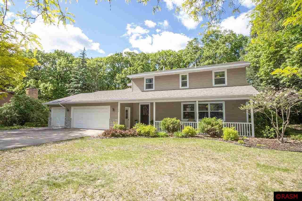 This beautiful two-story colonial style home sits on a quiet secluded ravine lot nestled between 2 parks.  It presents outside like a classic colonial, but one step inside and you will discover that it is anything but!  Thoughtful renovations provide a nice open feel to this home; while beautiful custom cabinets and millwork throughout speak to the care that has gone into this property.  Presented now for the first time in over 25 years, this truly is a rare for sale offering.   The facade of this amazing home beckons you in with its inviting front covered patio, but that pales in comparison to what you will experience once inside.  There you’ll take in the main level’s bright, open rooms, hardwood and carpet flooring, stainless steel appliances, granite countertops, ½ bathroom, and gas fireplace.  The formal living and dining rooms are great for entertaining, while the cozy family room is located just beyond the stylish kitchen and both rooms boast views of the private backyard and ravine. The upper level of this home is where you will discover 4 bedrooms.  The primary bedroom has a generous walk-in closet as well as stellar views of the wonderful backyard out the window.  The primary bedroom also boasts a private ensuite bathroom; complete with a jet tub and separate shower.  The guest bathroom on this level offers not only a full bathroom space, but also an additional sink and vanity to allow multiple people to get ready at the same time!   The lowest level of this home is relaxation central with a large rec room space, more built-in cabinetry, a generous laundry room with built-in cabinet and closet storage, and a ¾ bathroom.  To further sweeten the package that is this property, the attached triple garage has a 31’ extra deep third stall which could allow total parking space for 4!  Mature trees canopy the backyard with privacy, allowing the space to boast a two story storage shed, various perennial flower beds, a garden space, and a paver patio.  Beyond all that, this property is tucked away in an established neighborhood.  Guaranteed you will struggle to find a property that offers all that this one does!