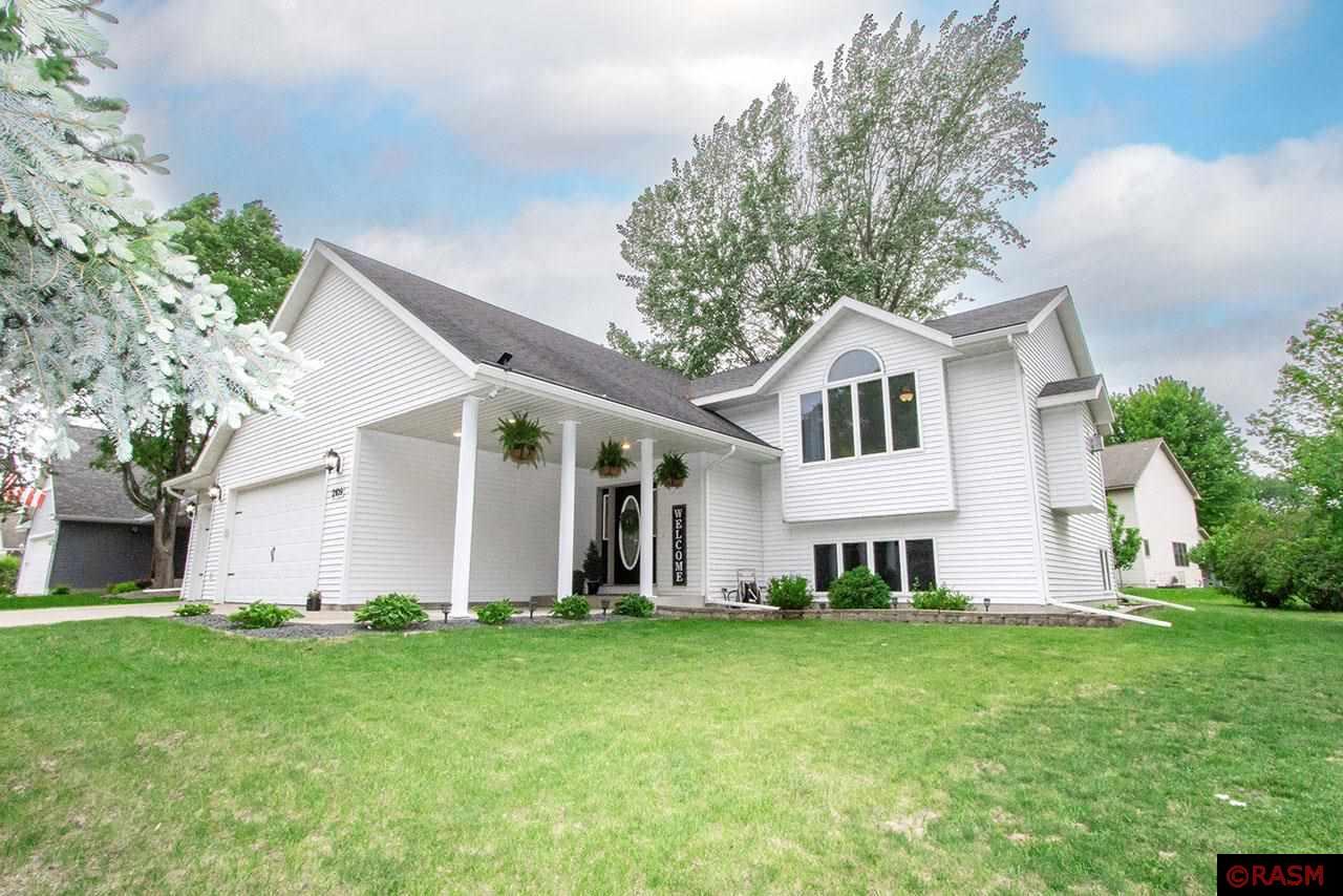 This meticulously maintained split level home with 4 bedrooms, 2 bathrooms and a triple-attached garage awaits!  Tucked back in a semi-private area of upper North Mankato, you are sure to treasure this one!  The covered front walkway leads you into the foyer where you will instantly feel at home.  Ascend the stairs to the upper level and discover the peaceful living room complimented by the gas fireplace and large picture window that overlook the front yard.  The informal dining room is just beyond with its wood flooring and patio door to the wonderful deck.  The kitchen is designed with function in mind and polished with stainless steel appliances.  These wonderful areas are all tied together by a vaulted ceiling.  Just down the hall you will find a full bathroom, the generous sized primary bedroom with walk-in closet, and the second bedroom.  Descend to the lower level where you will uncover a grand “L-shaped” family room, the second full bathroom, generous bedrooms 3 & 4, and the laundry/utility area.  Space galore awaits you in the triple attached garage, and you will adore the truly superb backyard.  There you will discover a wonderful two-tier deck, patio space, a storage shed under the upper deck, and beautiful mature trees!  The real bonus…a new roof was just installed 05.23.2025!  Add all that, along with the stellar care this property has received by the current owners, and this one is a steal!  Don’t wait, it won’t last!