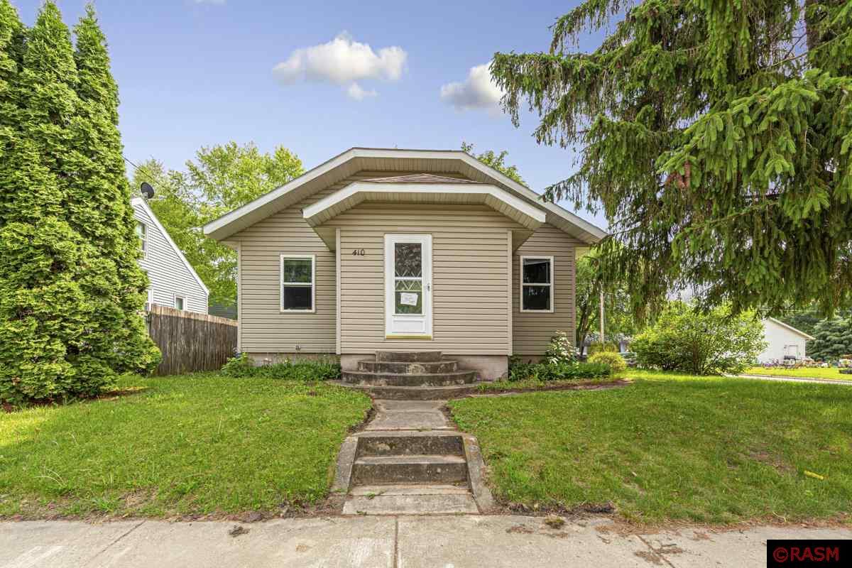 Located on a large corner lot, this two-bedroom home has lots of living space! This 1934 home offers authentic architecture such as arched hallways, galley kitchen, hardwood floors, and private dining room. However, a modern addition to the home in 1990 of a spacious and cozy family room with vaulted ceilings was added.  The main level bedrooms have generous sized closets; the main floor bathroom offers a walk-in tiled shower.  Just off the living room, is a large deck, sizeable yard, and detached wonderful, extra-large, heated, two car garage.  The lower level offers plenty of additional, unfinished space for an office, storage or play room. Washer and Dryer are in lower level as well.