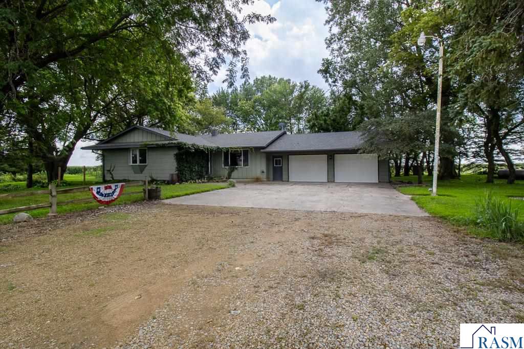 Charming 5-Acre Hobby Farm with Spacious Home and Versatile Outbuildings Welcome to your perfect country retreat! This well maintained 4-bedroom, 2-bath rambler is set on a serene 5-acre hobby farm, offering the ideal blend of comfort, functionality, and rural charm. The property includes several outbuildings, highlighted by a massive 40' x 62' pole shed—perfect for storage, livestock, or your next big project. Inside, the main floor features a thoughtfully designed layout beginning with a welcoming entryway. The spacious living room flows effortlessly into the open kitchen and dining area, where you’ll find ample cabinetry and counter space, stainless steel appliances, a breakfast bar, garage access, and a convenient pass-through to the spectacular Great Room. The Great Room truly lives up to its name, boasting vaulted ceilings, skylights, tiled floors, floor-to-ceiling windows, a cozy wood stove with a brick surround, and a built-in wet bar—perfect for entertaining or relaxing in style. One of the four bedrooms is currently used as a main-floor laundry, offering flexibility to suit your lifestyle. The main floor also features an updated full bath with a custom walk-in shower. Downstairs, the finished lower level offers even more space with a large recreation room, a 3/4 bath, an additional bedroom, multiple storage areas, and a versatile flex room ready to adapt to your needs. Whether you're dreaming of a small-scale farm, extra room for hobbies, or simply more space to spread out, this property has it all. Don’t miss this rare opportunity to enjoy peaceful country living with unmatched versatility!