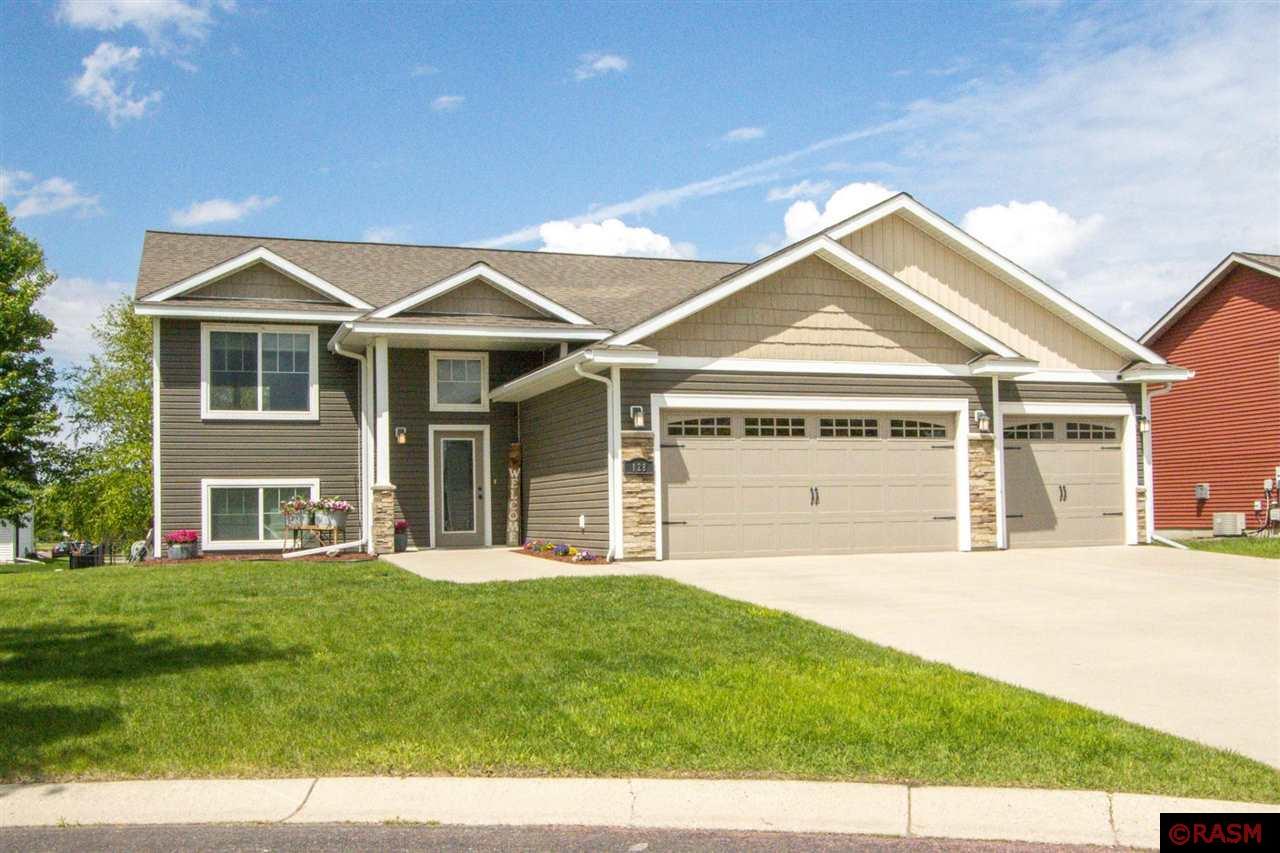 Beautiful and inviting bi-level hilltop Mankato home awaits its new owner… could it be you?  From your first step inside the tiled foyer, until your very last step out onto the patio in the backyard; this home is sure to please!  5 bedrooms and 3 full bathrooms make enough space for everyone!  The upstairs is boasts an open floor plan which is comprised of the living room, dining room and kitchen.  The kitchen is complete with maple cabinetry, stainless steel appliances, ceramic tile backsplash, and a center island with breakfast bar.  Just down the hallway is a spacious full bathroom with tile flooring, a Master suite with walk in closet and private full master bathroom, as well as two additional bedrooms.  Downstairs offers a spacious family room with electric fireplace, wet bar with custom cabinets, tile floor inset, and patio door to backyard patio.  There are also two additional bedrooms, as well as a full bathroom and the spacious laundry/utility room.  The property is complete with a deck and patio space off the back of the home, a generous triple attached garage, and the privacy of being near the end of the cul-de-sac.  You are sure to love this one!