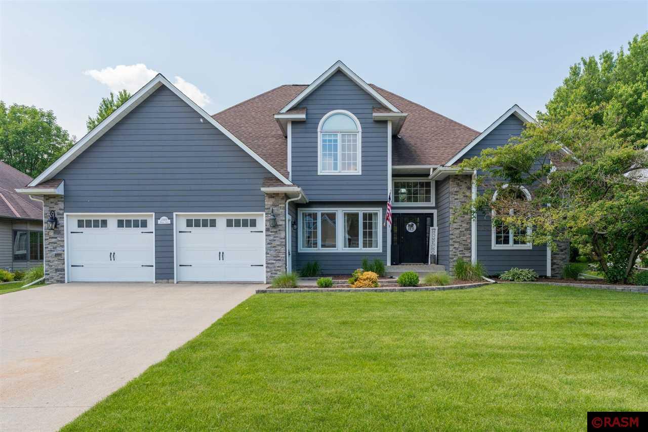 Recently updated & tastefully decorated, this 5 bedroom, 4 bath, 2-Story home located in Upper North Mankato is a MUST SEE!! The main floor offers a completely remodeled kitchen w/ white cabinetry, quartz countertops, subway tile back splash & stainless-steel appliances. The 2-story living room features a gas fireplace & beautiful hardwood floors throughout.  Just off the living room is the primary suite w/ vaulted ceilings, large walk-in closet, updated ¾ private bath w/heated floors. Also, located on the main level is the office & 1/2 bath & laundry room.  The upper level offers 3 bedrooms & recently updated full bathroom. The finished basement offers a large family room, 5th bedroom, 3/4 bathroom & huge storage/utility room. Additional features of the home include: Over-sized 2-car garage; updated light fixtures; radon system. (2020) New storage shed; Composite decking (2021) New water softener (2022) New tankless water heater. Please call today for your own private showing and see everything this beautiful home has to offer!