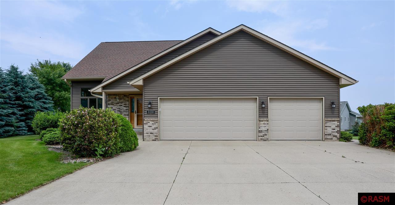 This spacious multi-level 4-bed, 3-bath home in the desirable Crystal Creek Subdivision features vaulted ceilings, a formal living room, open dining area, and a lofted bonus space. Enjoy a main floor primary bedroom, a fully finished basement, storage galore, and an oversized 3-stall garage with workshop extension. Relax on the maintenance-free deck and soak in all this vibrant lake community has to offer!