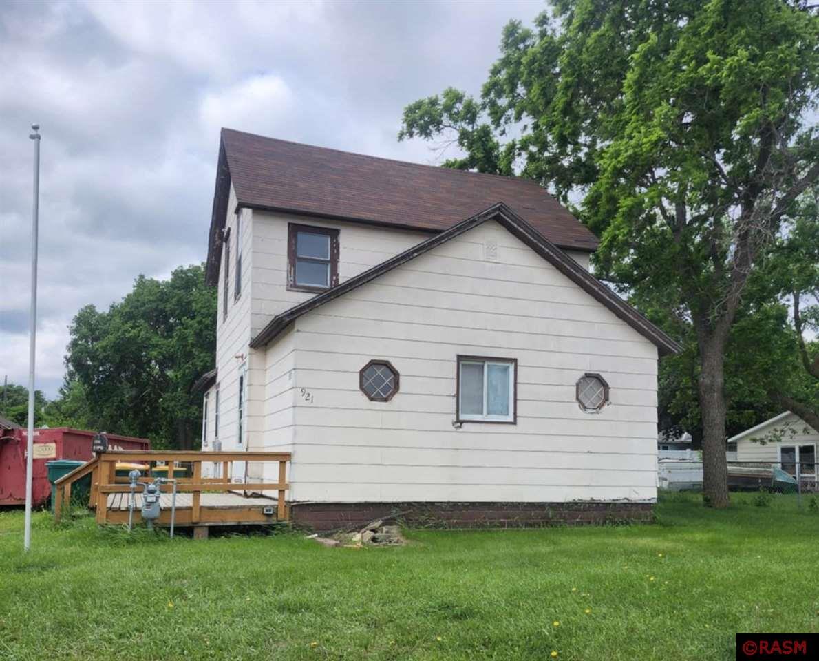 This 3-bed, 2-bath home sits on a spacious lot with tons of potential. Whether you're an investor, flipper, or someone ready to roll up your sleeves and build equity, this place offers a solid starting point. Inside, you’ll find original hardwood floors, octagonal accent windows, and a basement that’s been partially demoed — ready for your finishing touches. The home also features a newer front deck, detached single-stall garage, and a large open yard with alley access and mature trees. Located just off Hwy 71 with quick access to downtown and I-90 — a convenient spot for future projects or rental potential. Home is being sold as-is. Bring your vision and make it yours.