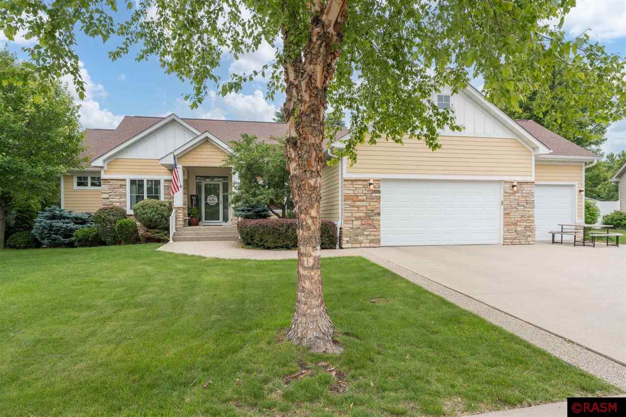 Exquisite ranch-style home located in the Rosewood Subdivision on Mankato's Hilltop.  Offering 5 bedrooms, 4 baths & over 4,000+ finished square feet, this home exudes quality and craftsmanship throughout!   The main floor of the home is highlighted by the sunken living room, which features custom built-ins, gas fireplace w/ stone surround & transom windows, kitchen w/ maple cabinetry, Cambria countertops, slate backsplash, stainless-steel appliances & walk-in pantry,  in-formal dining area w/ patio door for access to the maintenance free deck, fire-pit & backyard. Also located on the main floor is the primary suite which has an en-suite bath w/jacuzzi tub, dual vanity, separate tiled shower & spacious walk-in closet. Finishing out the main floor is the formal dining room, 1/2 bath, 2 additional bedroom w/ jack & jill bathroom & laundry/mud room. Moving downstairs, the basement offers the perfect place for entertaining family, friends or guests. The spacious family room features a wet bar w/ full-size refrigerator, theater room w/ projector & surround sound, newly added office, 2 additional bedrooms, 3/4 bathroom & the mechanical/utility room, which offers plenty of storage space. Additional features of the home include: 11-zone sprinkler system; insulated & finished 3-stall garage; fiber optic internet, fully fenced-in backyard. Please call today for your own private tour and see for yourself everything that this wonderful home has to offer!