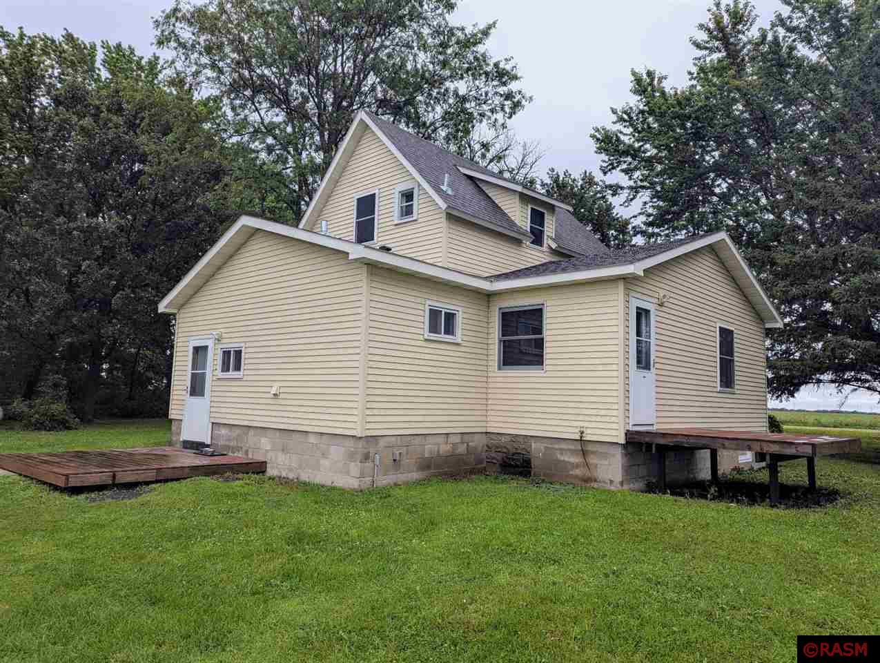 Peaceful Country Living on Nearly 4 Acres! This beautifully renovated 3-bedroom, 2-bathroom home is move-in ready and sits on just under 4 acres of scenic land. Updated from top to bottom, the home features all-new flooring, fresh paint, and crisp trim throughout. The main floor offers a spacious, refreshed kitchen with new countertops and appliances, along with an open-concept dining and living room that’s perfect for gathering. A convenient main floor bedroom and 3/4 bath with laundry complete the layout. Upstairs, you'll find two additional bedrooms and a full bathroom, ideal for family or guests. Major upgrades have been taken care of—including a new roof, siding, windows, water heater, furnace, reverse osmosis system, and septic system. Step outside and enjoy the peaceful setting from one of two decks, or take advantage of the 24x40 metal shed which is in great condition. Several other outbuildings provide added potential with a bit of TLC. Whether you're looking for a hobby farm, workshop space, or simply room to roam, this property delivers country charm with modern updates. Don’t miss your chance to call it home!