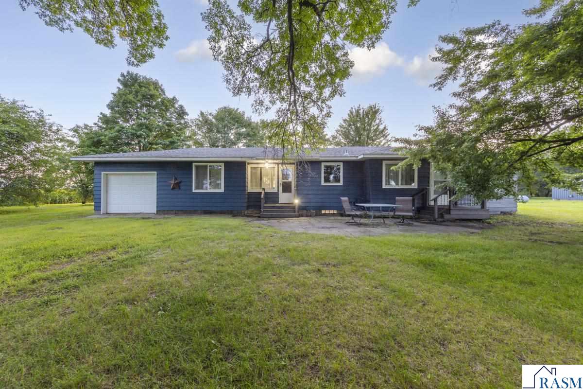 Welcome home to this charming 3-bedroom, 1-bathroom rambler nestled on nearly 3 acres just outside of Lake Crystal! Offering the ease of one-level living, this well-kept home features all three bedrooms and a full bathroom on the main floor, along with convenient main-level laundry that could easily be relocated to the basement for added flexibility. The bright dining area opens through sliding glass doors to a brand-new deck, perfect for morning coffee or evening sunsets overlooking your peaceful property. The unfinished basement provides endless potential to add living space, while the attached one-stall garage adds everyday convenience. Outside, you’ll find a large outbuilding equipped with 220v/100 AMP electrical and water ideal for storage, hobbies, or a workshop, and plenty of yard space for gardening or future projects. All new septic in 2019 with large mound placed on the far west end of the property behind the grove of trees. This home offers the perfect combination of country privacy and small-town accessibility—just minutes from Lake Crystal’s schools, parks, and amenities!