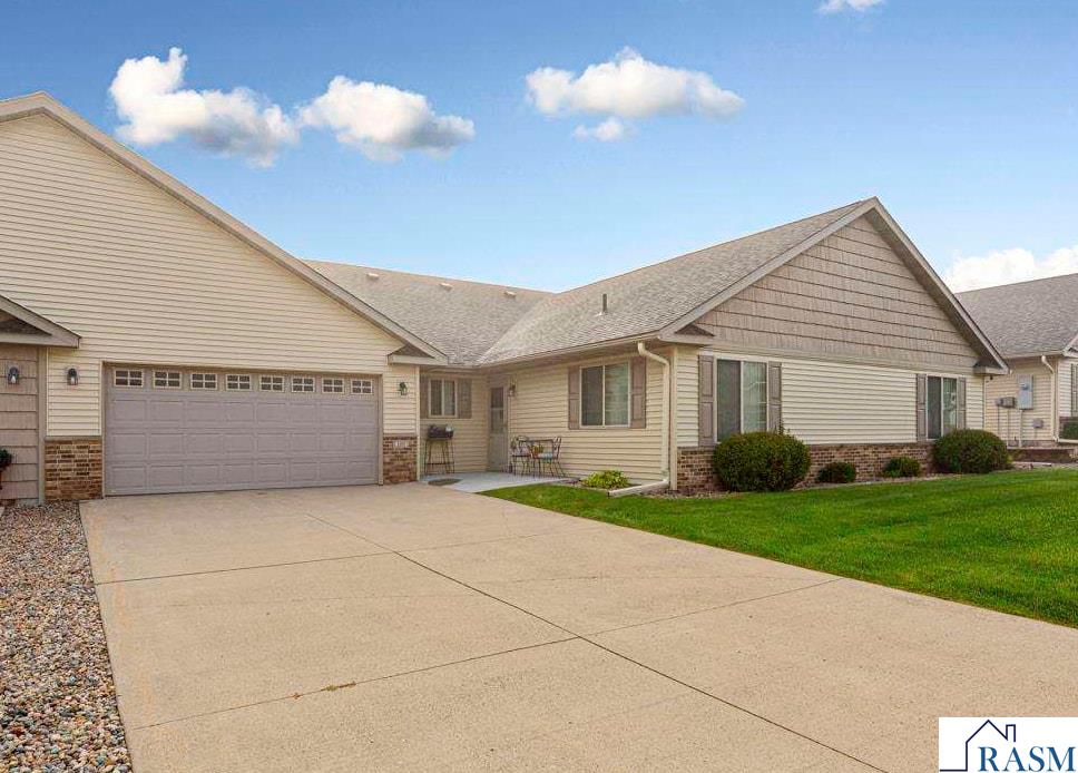 Welcome to this inviting 3-bedroom, 2-bathroom, 1-level patio home with a spacious 2-car garage, conveniently located on Mankato’s east side. With shopping, dining, and recreation nearby, you’ll enjoy both comfort and convenience. This one-level home offers an open floor plan that flows easily from the kitchen to the dining and living areas—ideal for gatherings and everyday living. Designed with zero-entry access from both the home and garage, it provides ease and accessibility for all. Large windows fill the space with natural light, creating a bright and welcoming atmosphere. The primary bedroom features a walk-in closet and an ensuite with a low-entry shower. Outdoors, a peaceful and private patio area adds the perfect touch for relaxation or entertaining. If you’re looking for a thoughtfully designed home with comfort, practicality, and style, this one is ready for you.