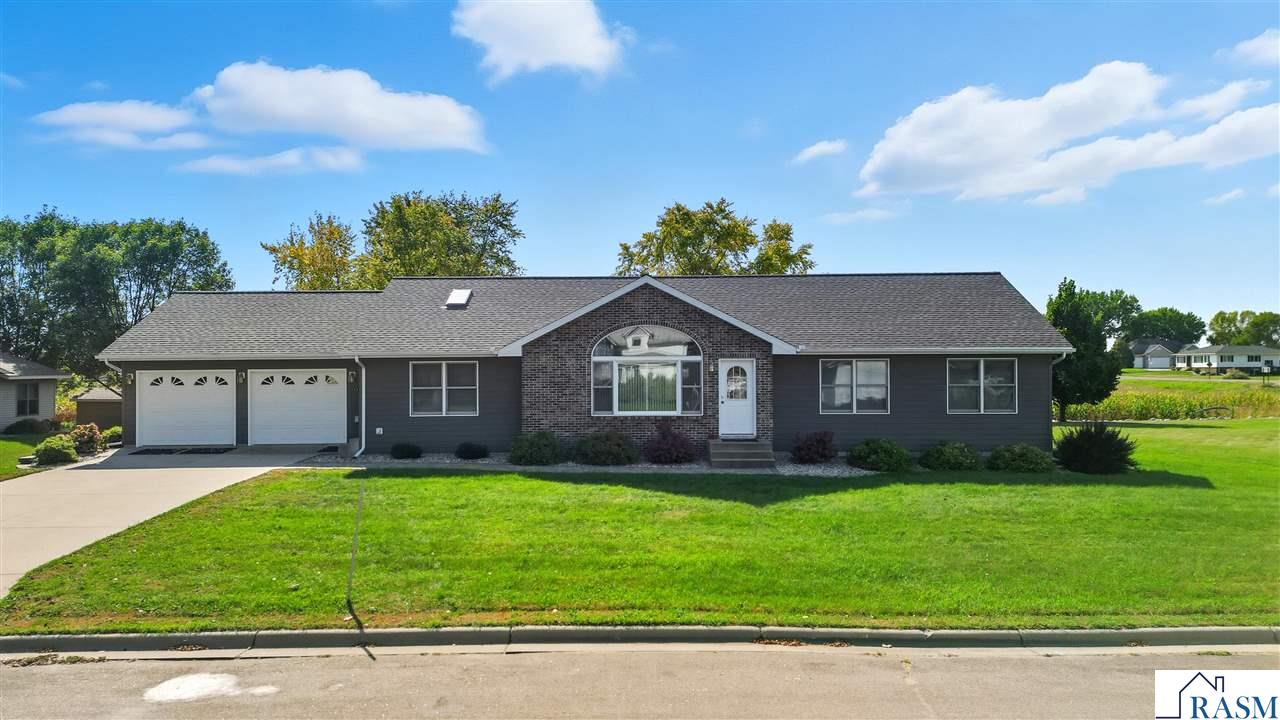 Step inside this spacious 3-bedroom, 3-bath rambler and discover a home designed for comfort and style. The main level features three generous bedrooms, a bright open-concept kitchen and dining area with a built-in fireplace—a unique touch that adds warmth and character—plus a vaulted living room, laundry room, and a private office. The lower level offers a versatile family room/ rec space, perfect for a media room, workout area, or hobby space.  Outside, you’ll find tasteful landscaping, mature shade trees, and a beautifully maintained yard that enhances the home’s curb appeal. The 2-stall attached garage adds convenience, while every corner of this home offers plenty of space to spread out and make your own. You must see this home in person to truly appreciate it's size and features.