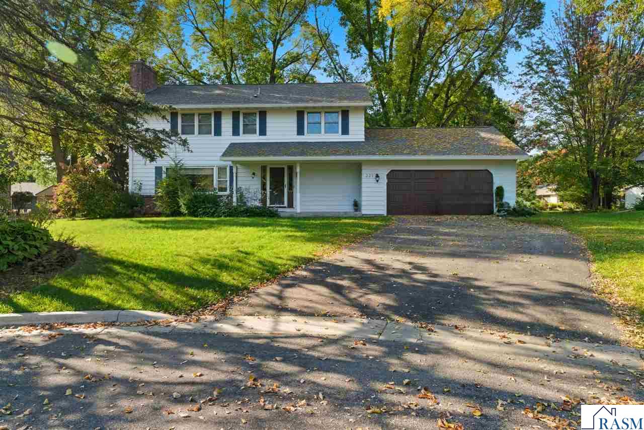 Brimming with timeless charm and curb appeal, this classic 2-story home has been thoughtfully maintained and beautifully updated, offering a warm and inviting atmosphere from the moment you arrive. The main floor welcomes you with a formal living room featuring a brick-surround fireplace, a formal dining room with views of the backyard, and an updated kitchen with granite countertops, tile backsplash, and newer appliances. A spacious family room and convenient half bath add to the comfort, while the screened 3-season porch provides the perfect spot to relax and unwind with an “up north” feel right at home. Upstairs, you’ll find five bedrooms, including a primary suite with a private ¾ bath, as well as a full bath to serve the remaining bedrooms. The lower level expands the living space even further with a large family/rec room complete with a wood-burning fireplace, laundry area, abundant storage, and a versatile bonus room currently being used as a workout space. The layout offers endless options for living, working and entertaining. Major updates include a new roof in 2020, new main-level flooring, and refreshed trim and paint, ensuring this home is move-in ready, with generous closet space & smart storage solutions throughout. Recent updates include fire-rated garage service door & firewall installed, sealed & painted walls in laundry room & workout area of basement, professionally steam cleaned carpets throughout, air ducts professionally cleaned throughout home, new carpet on stairway & some updated electrical items!
