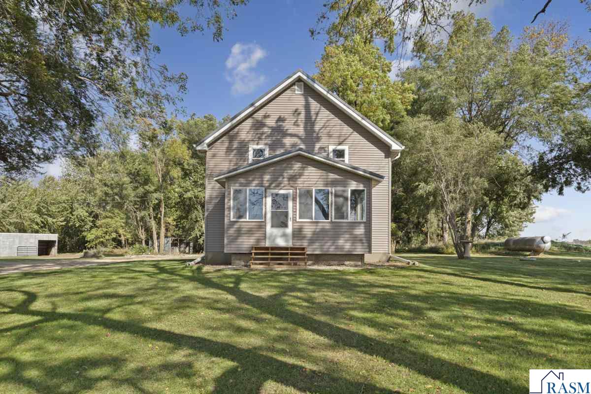 Discover the perfect hobby farm on 10 beautiful acres — with 4.5 tillable acres! This well-cared-for home features new siding, a new metal roof, and numerous updates throughout. Inside you’ll find 3 bedrooms plus a main floor room that could serve as a 4th bedroom, along with a remodeled kitchen showcasing brand-new cabinets, countertops, and appliances. The updated mudroom and new front porch add both charm and convenience. The bathroom has been completely remodeled, and there’s a stool and shower in the basement. Enjoy efficient forced-air heat furnace or the wood-burning furnace, which is tied into ducts. Additional upgrades include a 2022 water heater and a newer septic system. A transfer switch for a backup generator adds peace of mind. Outside, you’ll find a 50x48 pole shed with 25x30 of it sectioned off as a heated and cooled workshop/garage, plus a horse barn with electricity. Additionally, outside you will notice the acreage butts up to 150 acres of wild life management land. This property is exceptionally well maintained and truly move-in ready — the ideal setup for country living or your next hobby farm dream!