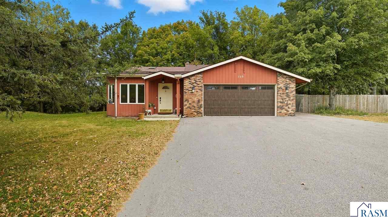 Welcome to 120 Maple Ridge Drive, where charm and comfort meet. The entry welcomes you with vaulted ceilings, skylights, and a touch of stained glass that fills the space with natural light and character.  The main level offers a bright dining area surrounded by windows, a thoughtfully designed kitchen with a center island and casual dining nook, along with a cozy living room with vaulted ceilings overlooking the scenic ravine lot.  Upstairs, you’ll find three inviting bedrooms, including a primary suite with an attached ¾ bath and an additional full bath. The lower level features a generous bedroom, a spacious family room highlighted by an exposed brick fireplace, and a combined laundry and ¾ bath complete with a utility sink. The open layout provides versatile space for a home office, studio, or media room.  Additional highlights include an extra room perfect for storage or a home gym, a large two-stall garage, and a private backyard offering peaceful ravine views. The current owners also purchased the adjacent open parcels next to and across from the property, enhancing the sense of privacy and space.  Residents of this neighborhood enjoy access to scenic association land with nature and ATV trails, picnic areas, and beautiful river valley surroundings — perfect for those who appreciate outdoor living and wide-open spaces.  Welcome home to comfort, space, and natural beauty — all in one of Mankato’s most desirable neighborhoods.