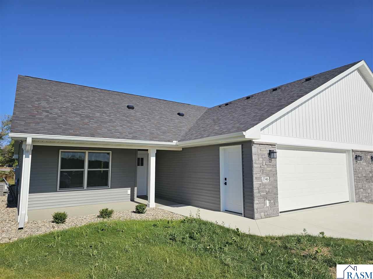 Beautiful new 2 Bedroom twin home built in 2025. This gorgeous home features a great sunroom, large primary suite features a walk-in closet, and a fabulous 3/4 bath. There's in-floor heat along with forced air heat as well, reverse-osmosis water treatment, speed queen washer & dryer, an open concept living room, dining area, and kitchen with solid surface countertops throughout. Call today to see this beautifully designed twin home!