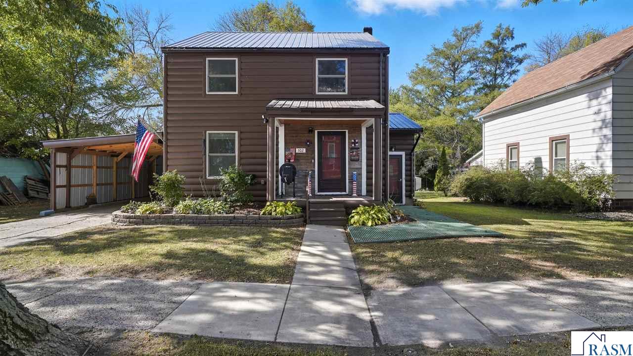 This 4-bedroom, 2-bath home combines classic charm with thoughtful updates throughout. The main level offers a bright living and dining area, updated flooring, and a functional kitchen layout. Upstairs you’ll find additional bedrooms and a full bath, while the finished lower level adds flexible space for a recreation or family room. Exterior highlights include a metal roof, attached garage with carport, and a fenced backyard offering space for outdoor enjoyment. The home also features updated windows, lighting, and propane heat. This home provides space and comfort — ready for its next chapter.