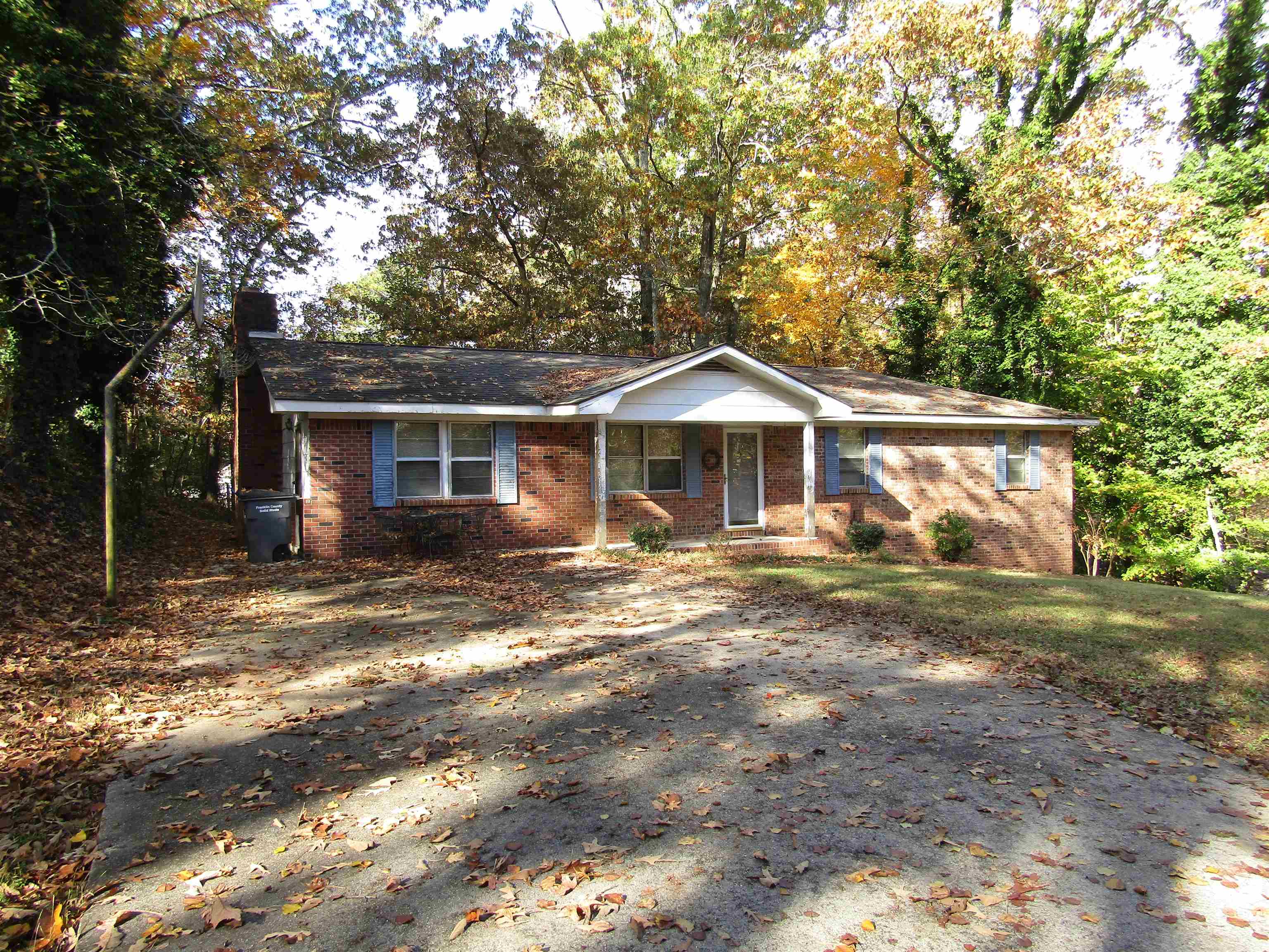 Great location!! Only blocks from Russellville Schools.  Great starter home.. 3 bedroom 1.5 bath brick rancher.  Carport has been enclosed for another living area with beautiful brick fireplace and inside laundry.  New deck has been built so you can enjoy the private backyard.  With just a little TLC, you can make it your own!