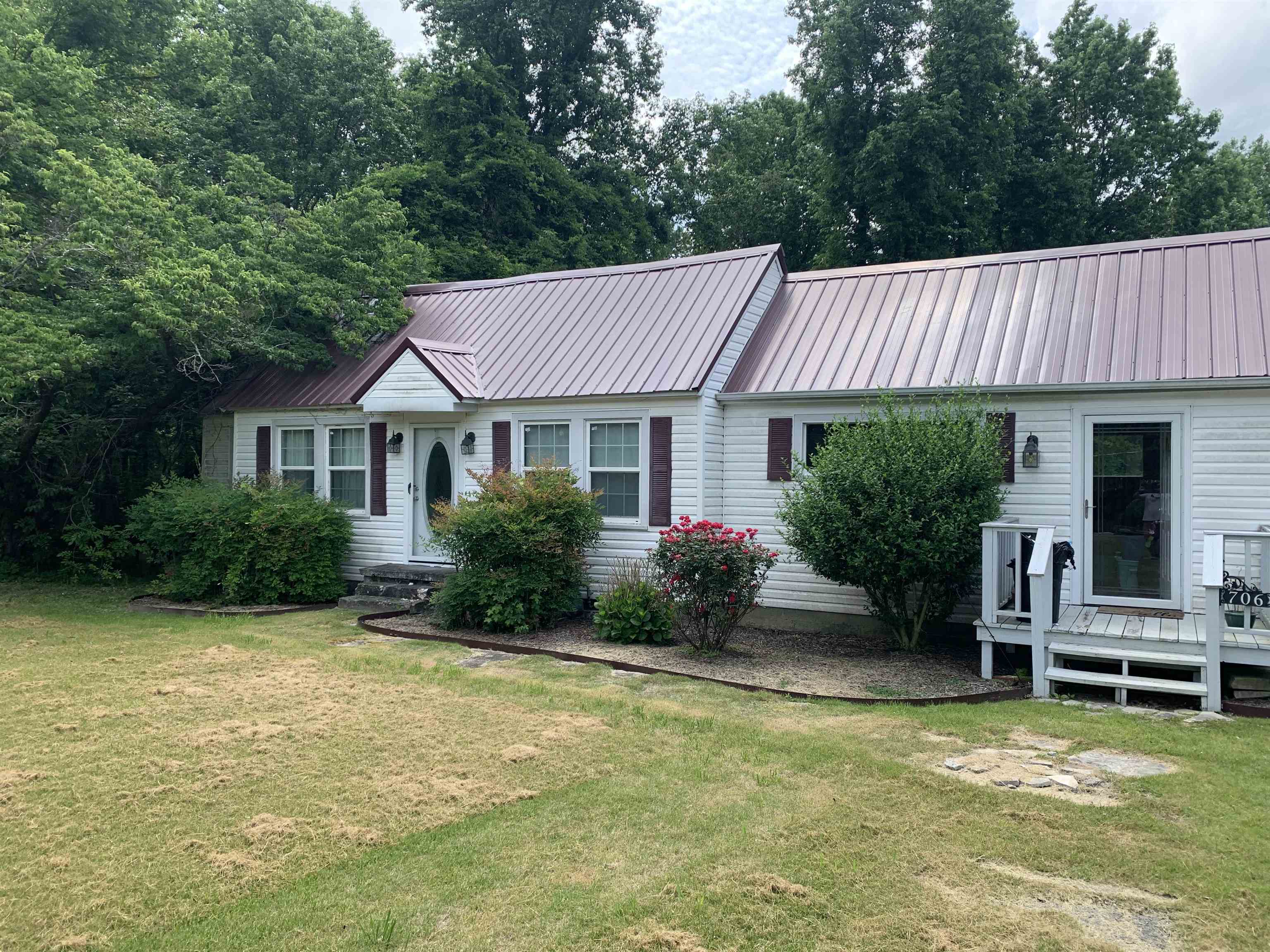 Where else can you find over 8 acres within the city limits of Phil Campbell.  This little cottage style house has tons of potential. Plenty of space and lots of stoarge and just minutes to the local schoools as well as community college.  Come see this before it gone.  Sold as is