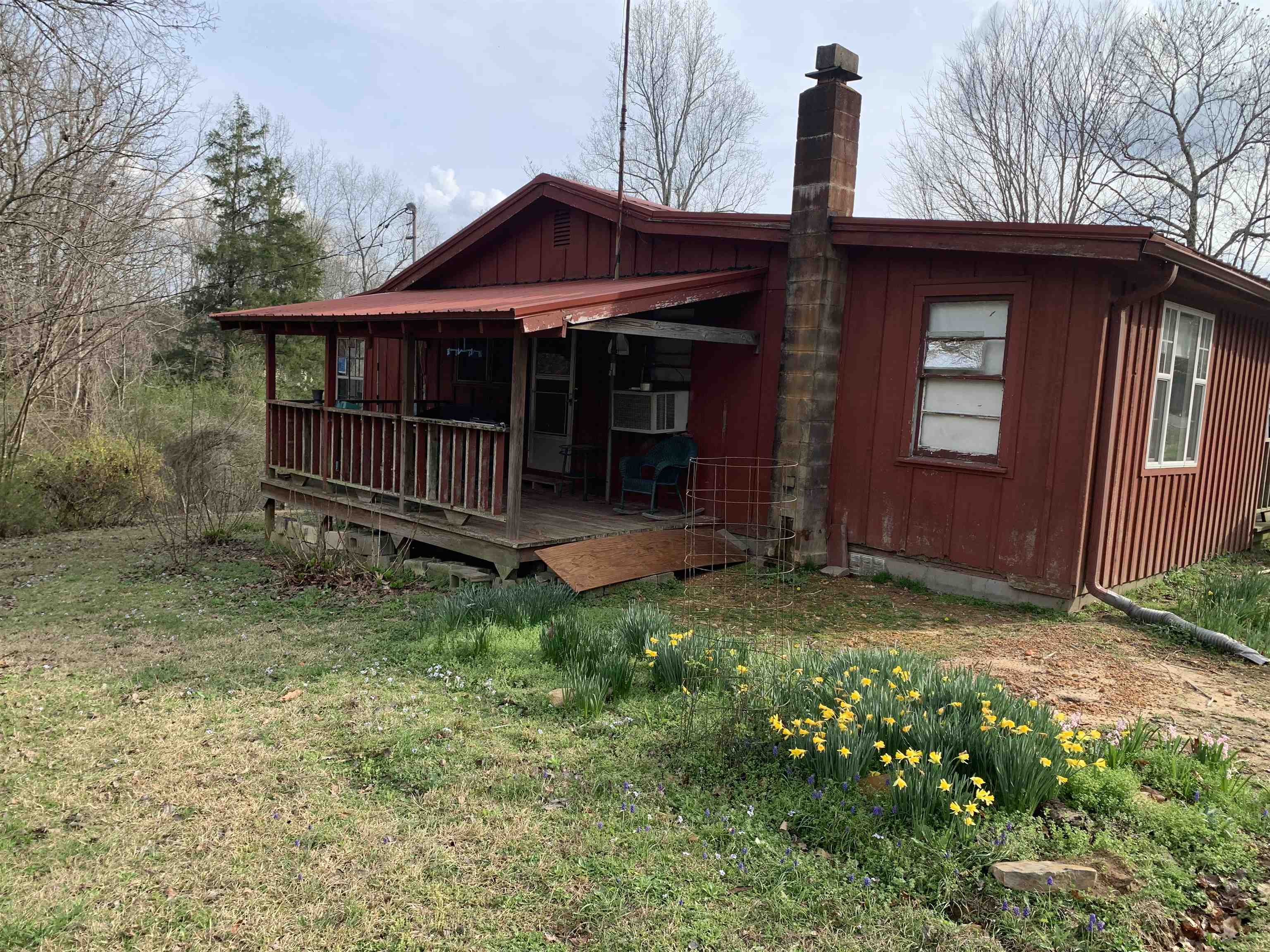 Priced to sell - great fixer upper with lots of possibilities!!  This property features 2.74 acres with a nice front porch and side porch.  3 Bedrooms and 1 bathroom with chestnut trees, plum trees, grape vines and blueberry bushes.  There is a storm shelter underneath outbuilding!  Call to schedule your private showing today!!