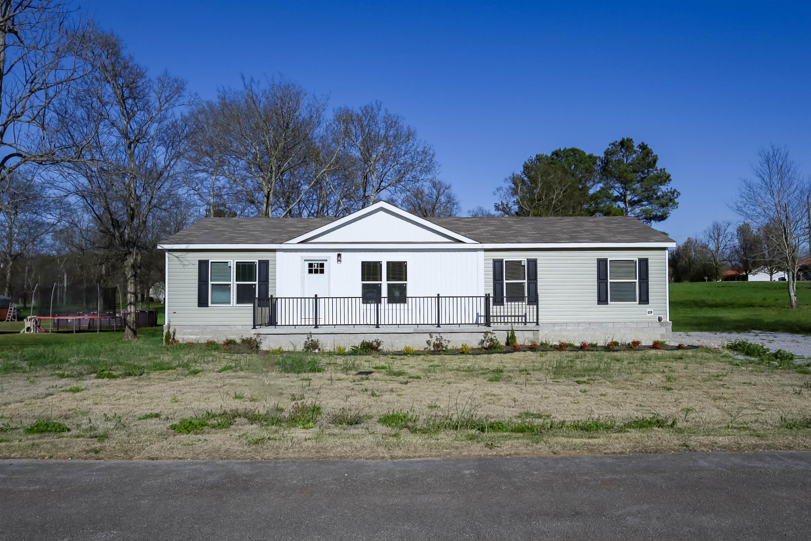 Welcome Home.  Located in Deer run Sub. in Russellville City limits.  Lets take a look at this adorable 3 bedroom/ 2 bath modular home.  You'll love the zoysia sod landscaping.  You have plenty space in the leveled front and backyard.  You've also got a concrete front porch, side porch and back porch.  Now to the inside, you've got brand-new stainless-steel Frigidaire appliances and all the furnishings inside the home will stay with the buyers at no extra cost.  WOW! Open floor plan, spacious bathrooms and private dining area.  Can you say move in ready.  Possible owner financing available.  Hablo Espanol posiblemente financiado de dueno a dueno.  llameme hoy.