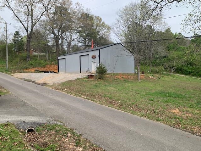 Lot features a 40x50 metal workshop constructed in 2019.  Lot is zoned Residential/Multi-faimily.  The building features two 10' sliding doors, one 12' slding door, and a walk-in door.  Electricity is conncted to the building.  Parcel 0293020000800010 is included with the purchase of this property.  Call to schedule your appointment today!