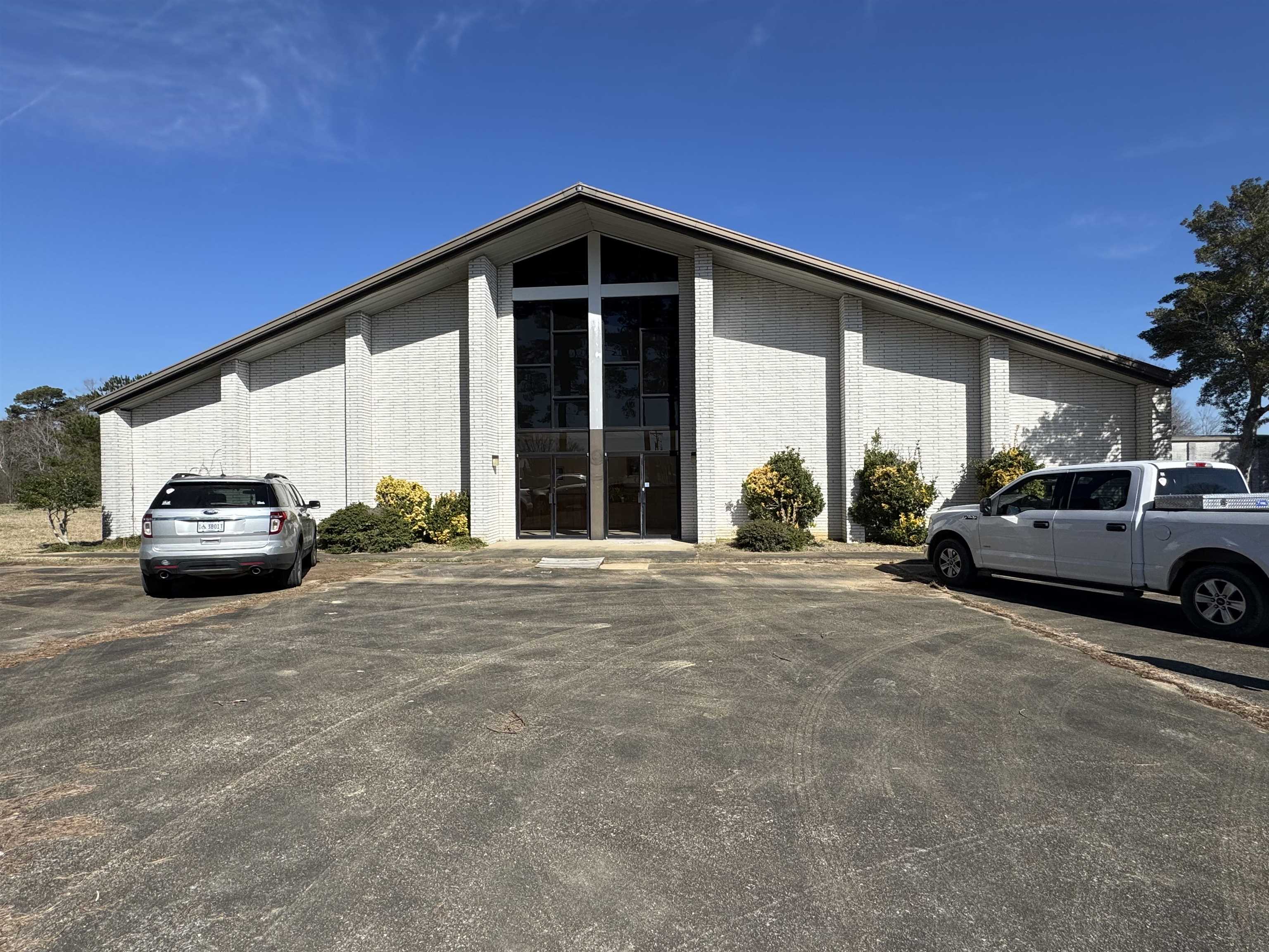 Great investment opportunity. This property comes with a large building 10,080 SF (84'x120'), a medium building 1800 SF (30'x60'), a small storage building and a very large concrete parking lot. And, it's on 5+/- acres in the city limits of Red Bay. What more do you need to start your business - ideal for antique mall, daycare, event center...limitless ideas! And with this much land, you have room to expand. It has public water, natural gas, sewer, and fiber is available. Pictures of floor plan are in pictures. What more could you ask for? Make an appointment soon to view this property. Property being sold AS IS.